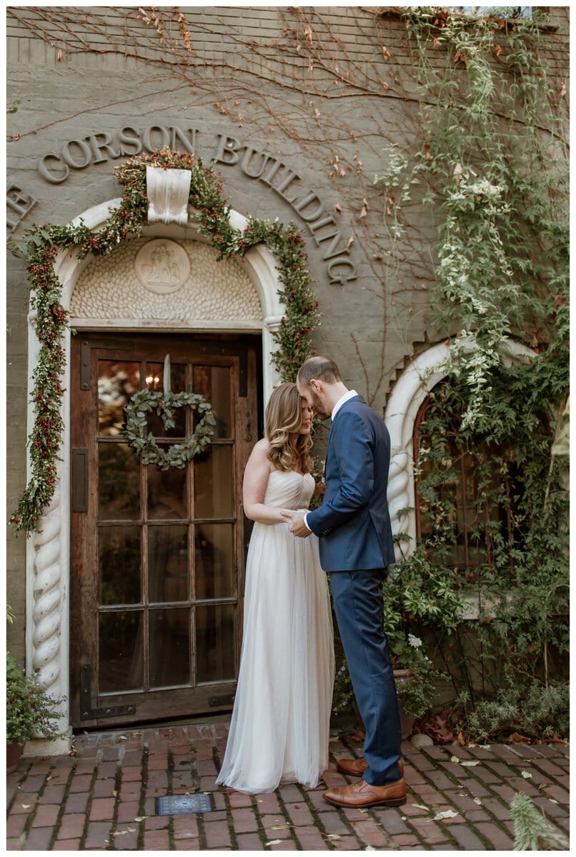 A bride and groom share an intimate first look outside The Corson Building. If you're wondering, "Should we do a first look on our wedding day?"—this heartfelt moment beautifully captures why it can be so special.