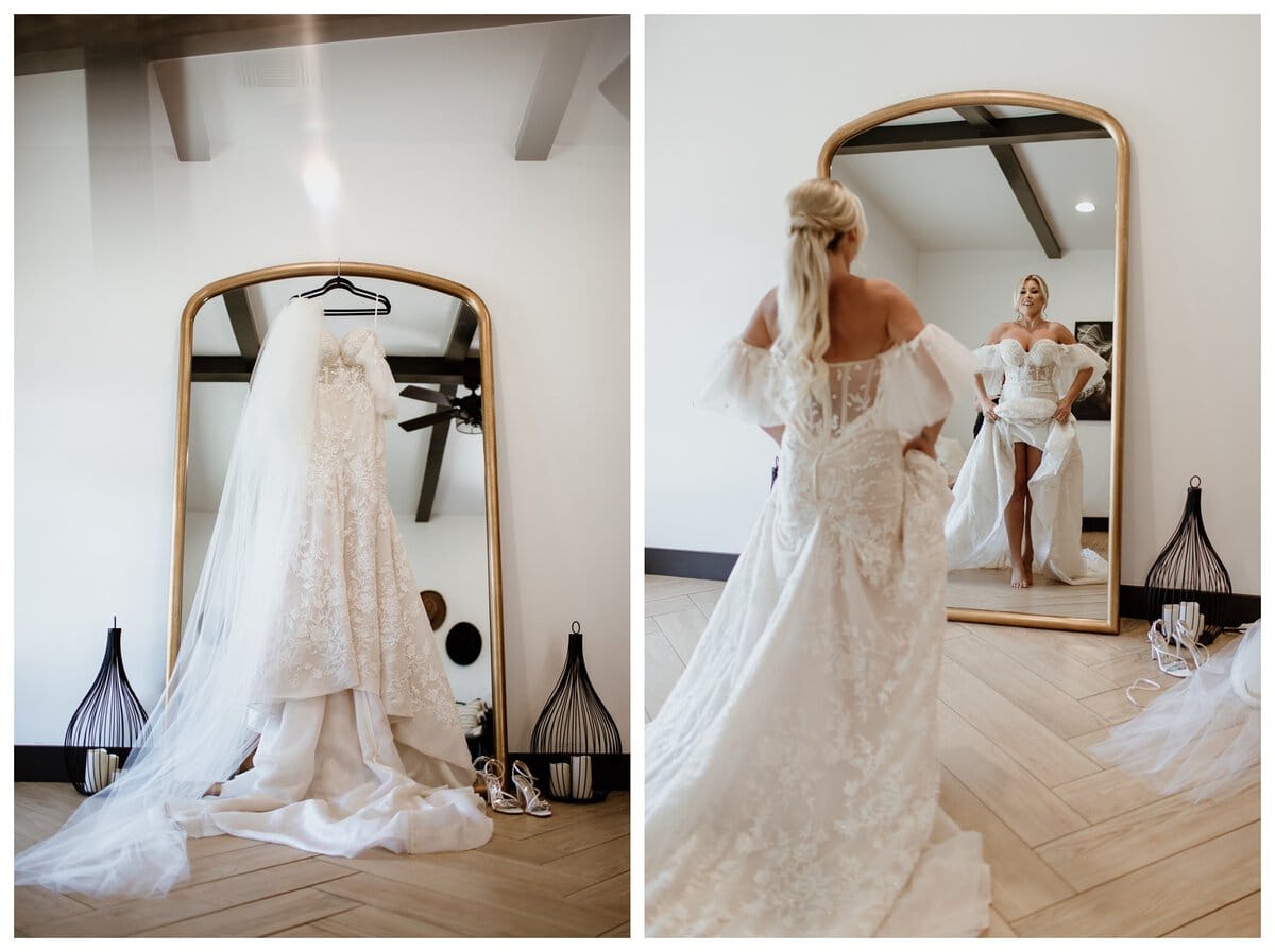 Bridal getting ready photos at Lazy S Hacienda wedding venue, featuring a lace wedding dress hanging on a mirror with a long veil and a bride admiring her gown in the reflection. 