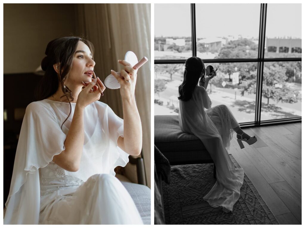 Bride getting ready by a large window before her Bowie House hotel wedding in Fort Worth, applying lipstick while overlooking the city in soft natural light.
