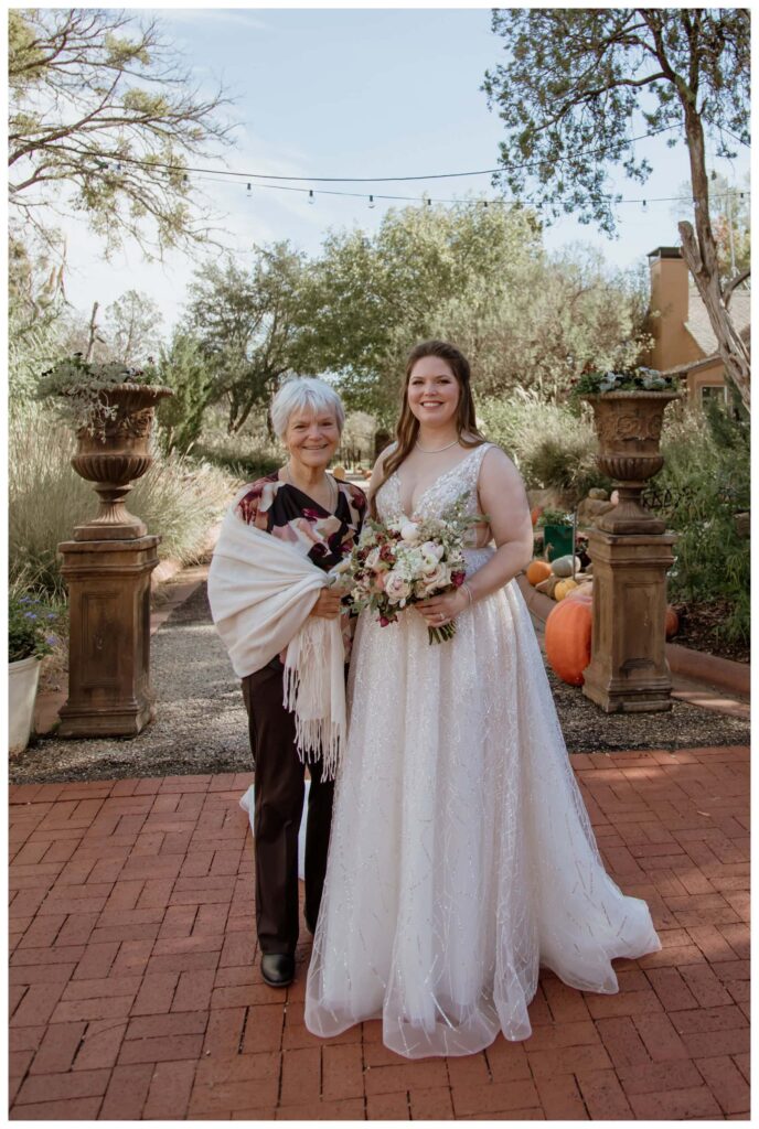 A bride and her grandmother pose for a sweet wedding family photo, captured by a Fort Worth wedding photographer.